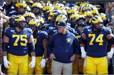  ?? PAUL SANCYA — THE ASSOCIATED PRESS FILE ?? Michigan head coach Jim Harbaugh waits to lead the team on the field during a 2019game against Army.