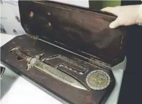  ??  ?? A knife with Nazi markings is seen at the Interpol headquarte­rs in Buenos Aires, Argentina. In a house near Argentina’s capital, police discovered the biggest collection of Nazi artifacts in the country's history. Natacha Pisarenko, The Associated Press