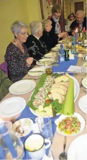  ?? Picture: JON HOUZET ?? BANQUET STYLE: Our table tucking into the smoked salmon roulade, served with ciabatta bread and lemon wedges