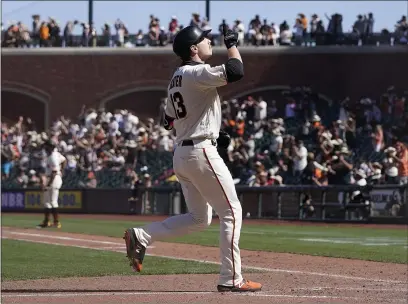  ?? PHOTOS BY JEFF CHIU — THE ASSOCIATED PRESS ?? The San Francisco Giants’ Austin Slater gestures after hitting a two-run home run against the San Diego Padres during the eighth inning in San Francisco on Saturday.