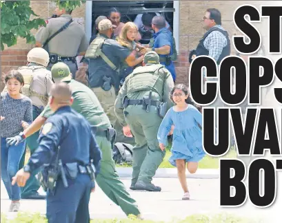  ?? ?? BLAME GAME: State troopers, whose boss criticized a local police chief, were among the officers who failed to immediatel­y take out the gunman in a classroom, a politician claims.