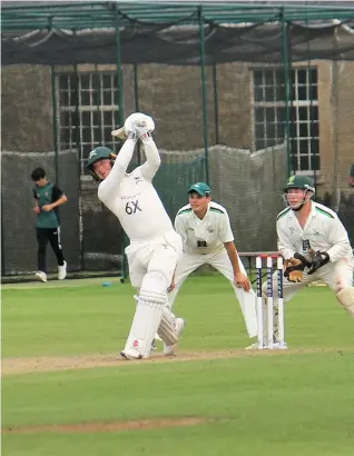  ??  ?? Wiltshire’s Jake Goodwin smashes a six to bring up his 50