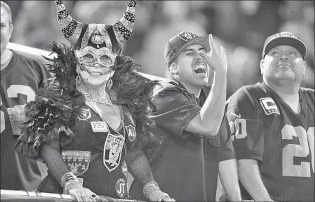  ?? Wally Skalij Los Angeles Times ?? RAIDERS FANS watch their team take on the Rams on Monday night. The team is set to move in 2020, but it could happen sooner.