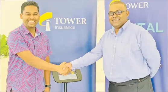  ?? Picture: ABISHEK CHAND ?? Asco Motors acting chief executive officer Ronald Kumar (left) with the Tower Insurance country manager Joseph Magnus during the launch of the Digital Kiosk in the Nabua showroom yesterday.