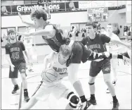  ?? MIKE ECKELS WESTSIDE EAGLE OBSERVER ?? Driving toward the basket, Gravette’s Brayden Trembly (Lions’ No. 33) runs into Lincoln junior Eli Rich (Wolves’ No. 12) during the first quarter of the Gravette-Lincoln varsity game in Gravette Dec. 3. Gravette won 61-41.