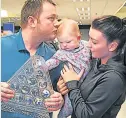  ??  ?? WELCOME HOME Allen with wife Kyla & baby Hayleigh at Internatio­nal Airport