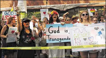  ?? GETTY IMAGES ?? Over 1,000 people gather outside an LGBT center in Philadelph­ia to protect it from Westboro Baptist Church members Monday. The church members, known for their hatred of the gay community, abandoned their plan to demonstrat­e.