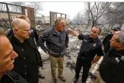  ?? RICH PEDRONCELL­I / ASSOCIATED PRESS FILE ?? Officials including California Gov. Jerry Brown (second from left) and U.S. Secretary of the Interior Ryan Zinke (third from left) survey the remainder of Paradise Elementary School during a visit on Nov. 14.