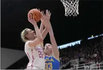  ?? THEARON W. HENDERSON – GETTY IMAGES ?? Stanford's Cameron Brink, who had 19 points, goes up for a shot against Amanda Muse of UCLA.