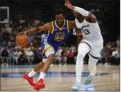  ?? NHAT V. MEYER — BAY AREA NEWS GROUP ?? The Warriors’ Andrew Wiggins goes up against the Grizzlies’ Jaren Jackson Jr. in the last round. Wiggins is averaging seven rebounds a game.