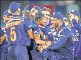  ?? AFP ?? India players celebrate after T Natarajan dismissed Glenn Maxwell during the first T20I.