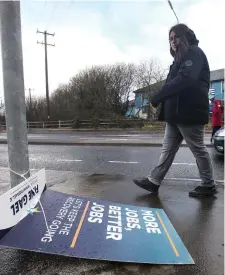  ??  ?? Wet and windy weather wrecked havoc with election posters like this one above at Ballinode. Pic: Carl Brennan.