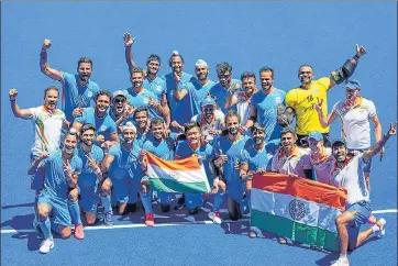  ??  ?? Indian players pose after their victory over Germany in the men's bronze medal play-off in Tokyo on Thursday. India won , 5-4.
