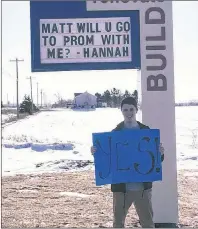  ?? SUBMITTED PHOTO ?? Matt Thompson agrees to a creative “promposal” from Hannah Johnstone. It was displayed on the billboard outside the Spring Valley Castle Building Centre in Kensington.