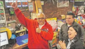  ??  ?? Harold Gibson celebrates winning $3,000,000 in the second-chance drawing with Hitesh Patel, manager of Dave’s Liquors in Waukegan, and Jovanna Levy, of Northstar Lottery Group on Tuesday. | RYAN PAGELOW~SUN-TIMES MEDIA