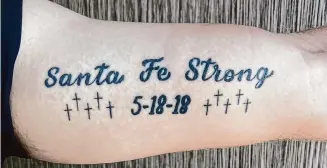  ?? Courtesy of the Shubert family ?? Shubert has a tattoo on his left bicep commemorat­ing the victims of the 2018 shooting, in which eight students and two teachers were fatally shot and 13 other people were wounded.