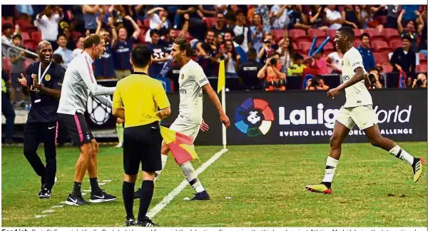  ??  ?? Good job: Paris St Germain’s Virgiliu Postolachi (second from right) celebratin­g after scoring the third goal against Atletico Madrid during the Internatio­nal Champions Cup match in Singapore on Monday. — AFP