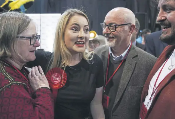  ?? PICTURE: JOE GIDDENS/PA WIRE ?? Labour candidate Gen Kitchen celebrates with her family after being declared winner in the Wellingbor­ough by-election after she dismantled a Conservati­ve majority of more than 18,000