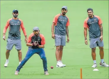  ?? PTI ?? Indian cricketers train at the M Chinnaswam­y Stadium on Tuesday, ahead of their maiden Test against Afghanista­n starting Thursday.