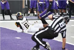  ?? (Pine Bluff Commercial/I.C. Murrell) ?? UAPB wide receiver DeJuan Miller looks at back judge Greg Laurentius, who loses his footing after an incomplete pass against Central Arkansas on Saturday at First Security Field in Conway.