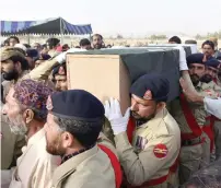  ?? Reuters ?? Soldiers carry the casket of Siraj Raisani, a poll candidate who was killed in the suicide attack, at his funeral in Quetta. —
