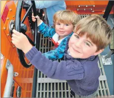  ??  ?? Max and Gus Laing take the steering wheel on the Oban lifeboat. What could possibly go wrong?