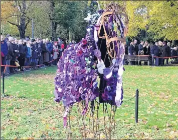  ??  ?? ■ Remembranc­e Sunday in Queen’s Park had a new element to the usual service this year, with the model of Loughborou­gh’s war horse - Songster - wearing a blanket of purple poppies.
