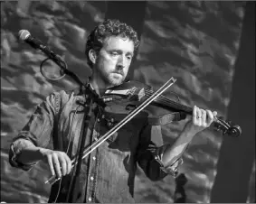  ??  ?? Multi-instrument­alist and fiddle player with The Frames Colm Mac Con Iomaire