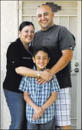  ??  ?? Mother Diana, father Alfred and son Zareh Shamirza at their Las Vegas home Thursday.