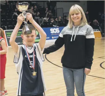  ??  ?? Above: Jake Nesbitt lifting the Hoops for Health basketball trophy. Below: Seaburn Dene (centre) with Barnes, St Cuthbert’s and Farringdon Primary Schools.