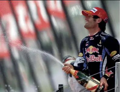  ??  ?? A very happy Mark Webber after his win in 2010 when, on crossing the line, he uttered the words: “Fantastic, guys, not bad for a number two driver. Cheers.” Webber had been displeased that a new front wing on his Red Bull had been removed after practice and put on to team-mate Sebastian Vettel’s car for qualifying