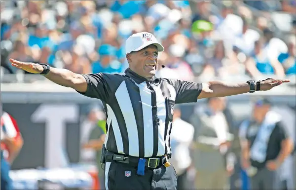  ?? [ASSOCIATED PRESS FILE PHOTOS] ?? Referee Jerome Boger makes a ruling during last week’s game in Jacksonvil­le, Fla.