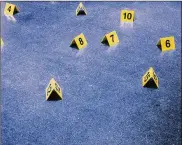  ?? ?? “Options” (2019), consisting of yellow evidence markers, in the Virgil Abloh exhibition, “Figures of Speech,” at the Museum of Contempora­ry Art Chicago on Aug. 12, 2019. Abloh’s artwork referenced the police killing of Laquan McDonald in Chicago.