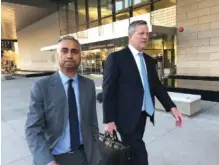  ?? AP FILE PHOTO/ BRIAN MELLEY ?? Imaad Zuberi, left, leaves the federal courthouse in Los Angeles with his attorney Thomas O’Brien, right, after pleading guilty to funneling donations from foreigners to U. S. political campaigns.