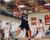  ?? OWEN MCCUE - MEDIANEWS GROUP ?? Phoenixvil­le’s Will Allain (13) goes up for a layup Tuesday as Owen J. Roberts’ Gus Coroniti (2) watches.