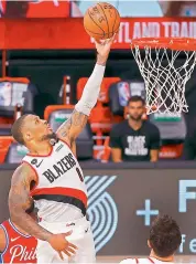  ?? AFP ?? Damian Lillard of the Portland Trail Blazers goes up for a shot against the Philadelph­ia 76ers during their NBA match in Lake Buena Vista, Florida. —