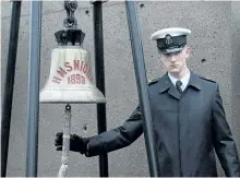  ?? ANDREW VAUGHAN/THE CANADIAN PRESS ?? A sailor rings the bell from HMS Niobe at a ceremony to mark the 100th anniversar­y of the Halifax Explosion at Fort Needham Memorial Park in Halifax on Wednesday.