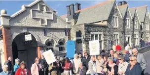  ??  ?? Protesters gather outside Porthcawl’s public toilets which are threatened with closure