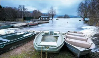  ??  ??  IN THE ROUND
The Welsh Crannog Centre shows what the buildings on the lake’s manmade island would have looked like, with a thatched roundhouse.
▲ ROW YOUR BOAT
In summer you can hire boats to look for Gorsey, and paddle out past the crannog – the wooded isle at centre of picture.