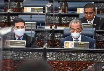  ?? — Bernama ?? Rapt attention:
Prime Minister Tan Sri Muhyiddin Yassin, Takiyuddin (back row) and Internatio­nal Trade and Industry Minister Datuk Seri Azmin Ali attending the Parliament­ary session last week. Takiyuddin tabled the amendments of the Bills for its first reading yesterday.