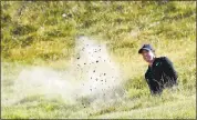  ?? ANDY BUCHANAN— AGENCE-FRANCE PRESSE VIA GETTY IMAGES ?? Rory McIlroy plays from a bunker which led to a doubleboge­y at the 10th hole Saturday.