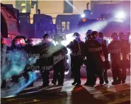  ?? ASSOCIATED PRESS FILE PHOTO ?? Authoritie­s disperse protesters Aug. 25 in a park in Kenosha, Wis. Kenosha County Sheriff David Beth said more than 200 people have been arrested since the protests began. Some officials fear a presidenti­al visit planned Tuesday could cause more unrest.