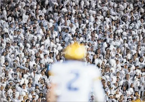  ?? BRETT CARLSEN/GETTY ?? The Penn State student section cheers during the Nittany Lions’ game against the Michigan Wolverines on Oct. 19, 2019, in University Park, Pennsylvan­ia.