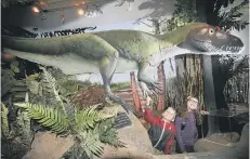  ??  ?? Max Hesp and Emily Maudsley come face to face with a dinosaur 164018d