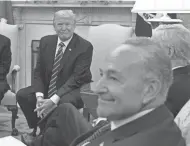  ?? EVAN VUCCI / AP ?? President Donald Trump and Senate Minority Leader Chuck Schumer, D-N.Y., banter Wednesday during a meeting with congressio­nal leaders in the Oval Office.