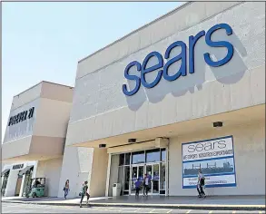  ?? AP/ALAN DIAZ ?? Customers enter a Sears store on May 11 in Hialeah, Fla. Sears Holdings Corp. reported a firstquart­er profit of $244 million on Thursday.