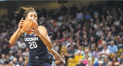  ?? Willie J. Allen Jr. / Associated Press ?? UConn’s Olivia Nelson-Ododa (20) grabs a rebound against Central Florida on Thursday in Orlando, Fla.