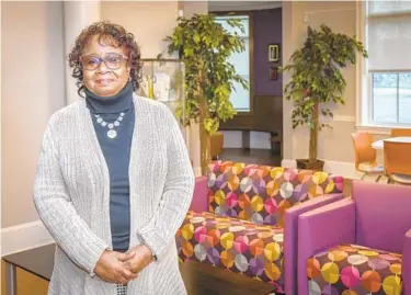  ?? BARBARA HADDOCK TAYLOR/BALTIMORE SUN ?? Veronica Land-Davis, executive director of Roberta’s House, a family grief support center, stands in the lobby at the organizati­on’s new building on North Avenue.