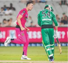  ?? Picture: AAP ?? GOT HIM: The Sixers’ Josh Hazlewood celebrates the wicket of Peter Handscomb last night.