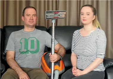  ?? PHOTO: STUFF ?? Richard and Olivia Knights, of Dunedin, and a trade-in vacuum cleaner that was returned.